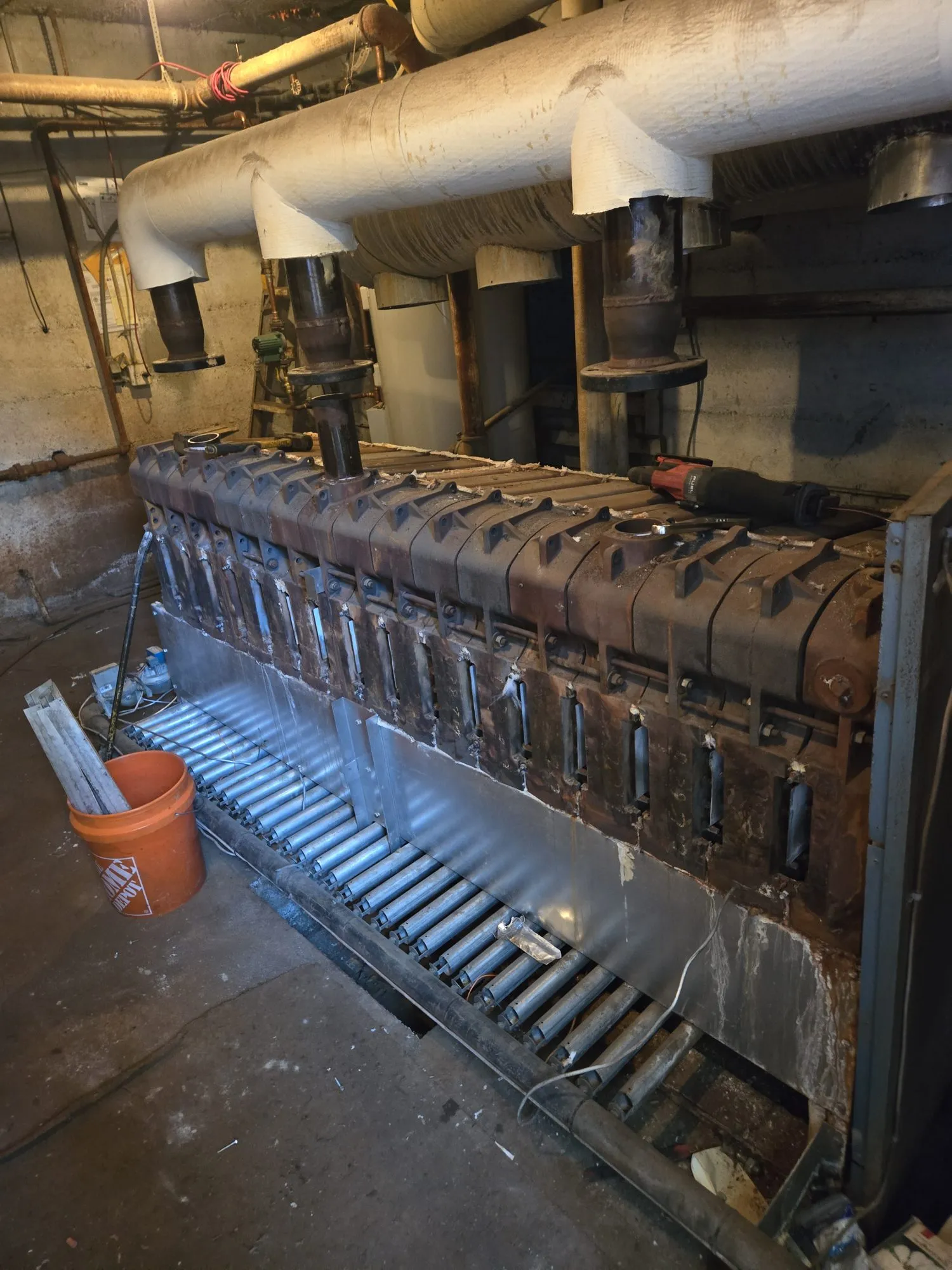 Cast iron sectional boiler opened up for section-by-section demolition