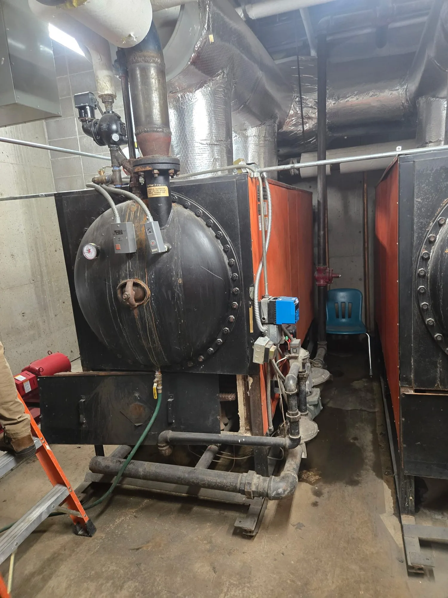Firetube boiler in a school mechanical room before demolition