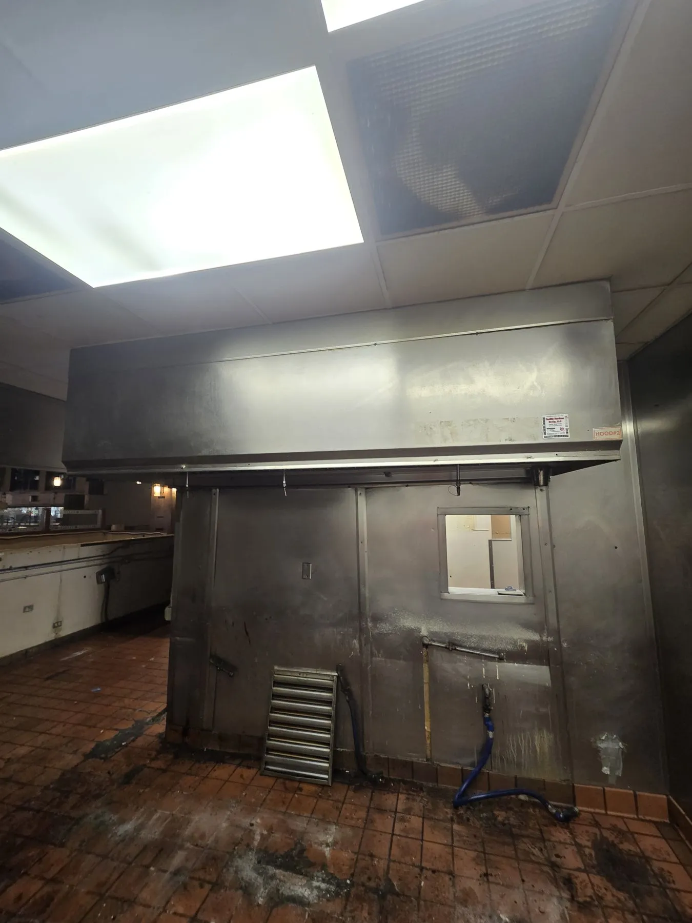 Commercial kitchen exhaust hood line before removal