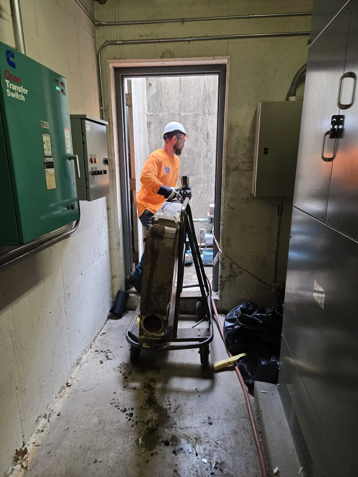 Gadge Bell moving a 700-pound boiler section on a dolly