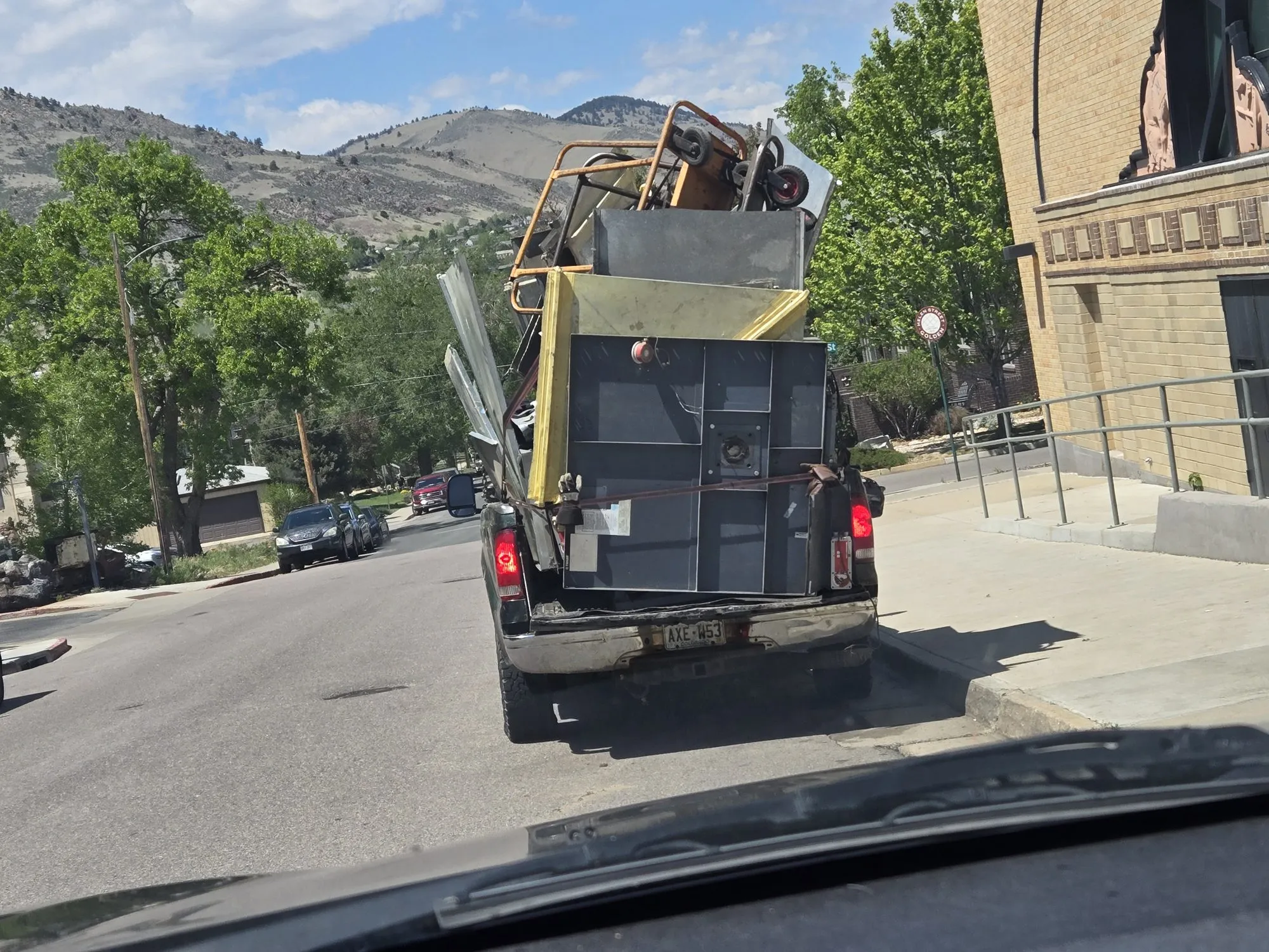 Truck loaded with sheet metal and equipment for haul-away
